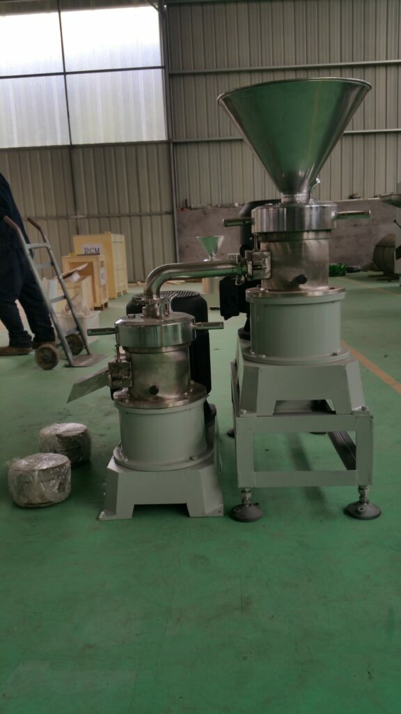 behind part of peanut butter grinding machine